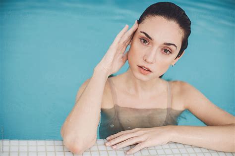 Portrait Of Beautiful Woman In Swimming Pool By Stocksy Contributor