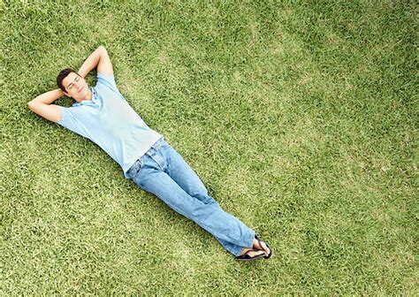 man lying  grass top view stock  pictures royalty