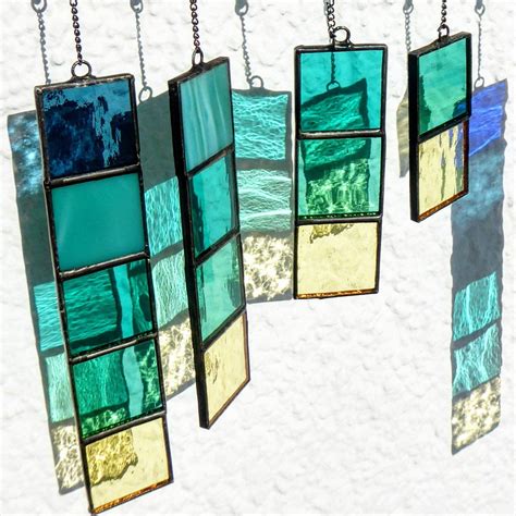 Pieces Of Sea Waves And Beach Sand Performed In Glass Stained Glass