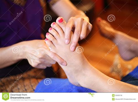 reflexology foot massage spa foot treatment  wood stick stock photo