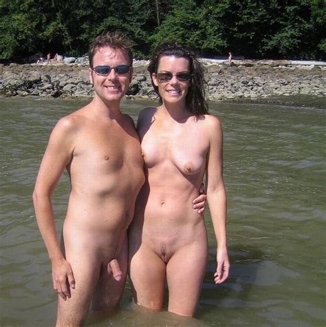 Happy Naked Couple On A Beach With Guy S Pierced Semi Hard