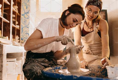 two women at a pottery workshop ~ people photos ~ creative market