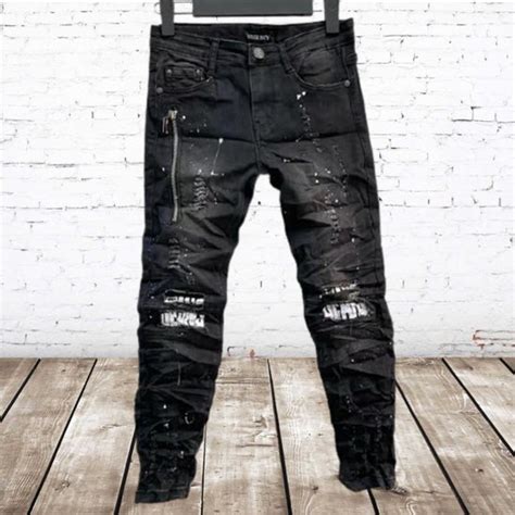 zwarte jeans met scheuren en witte print  sc  spijkerbroek jongens bolcom