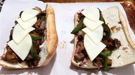 ribeye philly cheesesteak sandwiches have long crusty rolls filled with