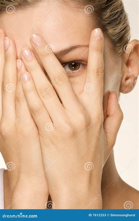 girl covering  face  hands  eye exposed stock image image