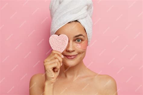Free Photo Headshot Of Young Woman Applies Patches Under Eyes For