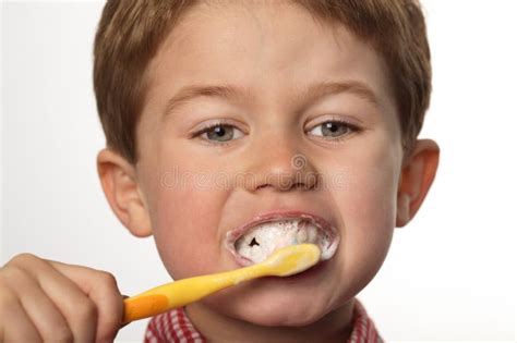 young boy brushing teeth stock image image  face