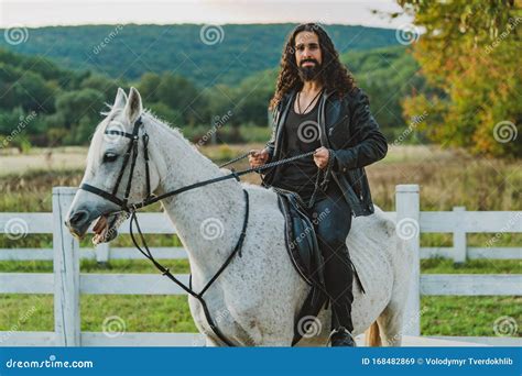 handsome rider man  horse equestrian rides  white