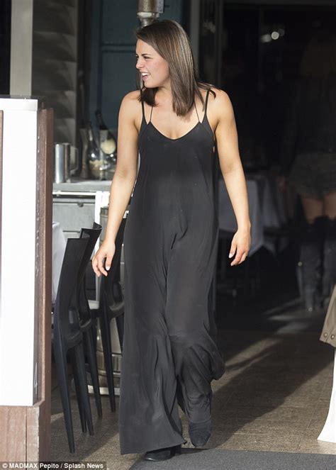 jodi anasta wears tight leather trousers with neighbours co star