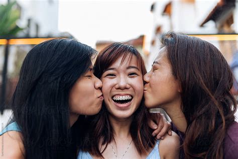 Asian Friends Women Having Fun In The Street By Stocksy Contributor