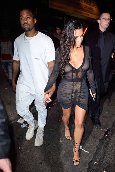 Kim Kardashian And Kanye West Look Engrossed In Their Phones Backstage
