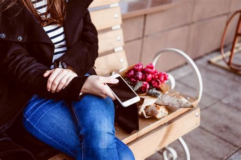 free photo french woman in a red beret on a street bench