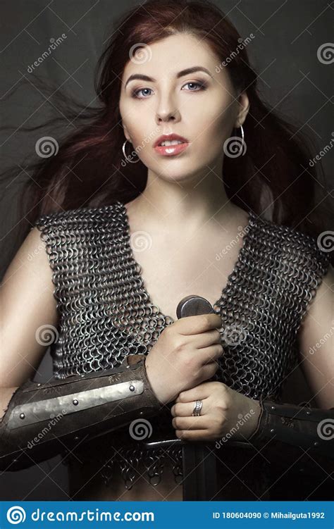 Beautiful Girl Warrior In Chain Mail With A Sword In His