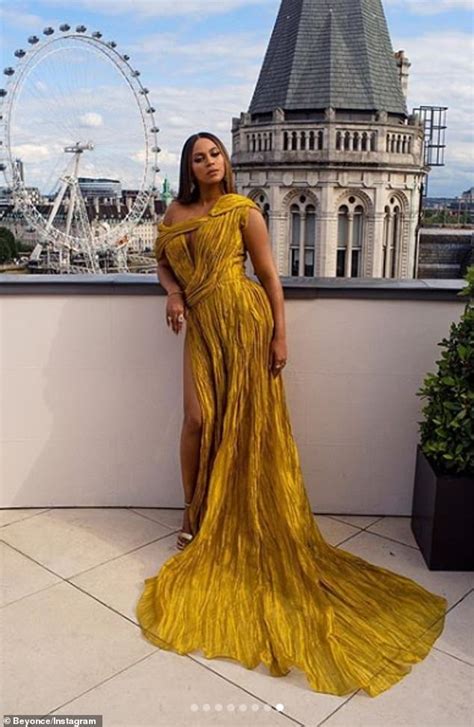 Beyoncé Poses On A London Rooftop In Her The Lion King Premiere Gold