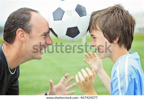 young soccer player father stock photo  shutterstock
