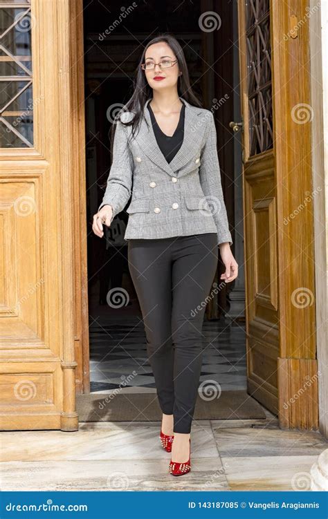 young woman exiting   door stock image image  businesswoman