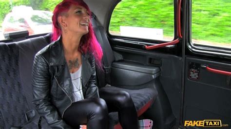 tattooed babe with purple hair displays her foxy body in a fake taxi wearing her black leather