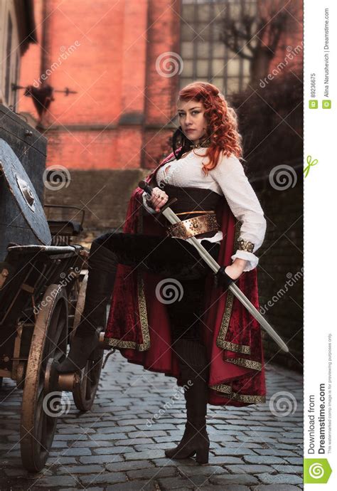 Warrior Woman With Sword In Medieval Clothes Is Very