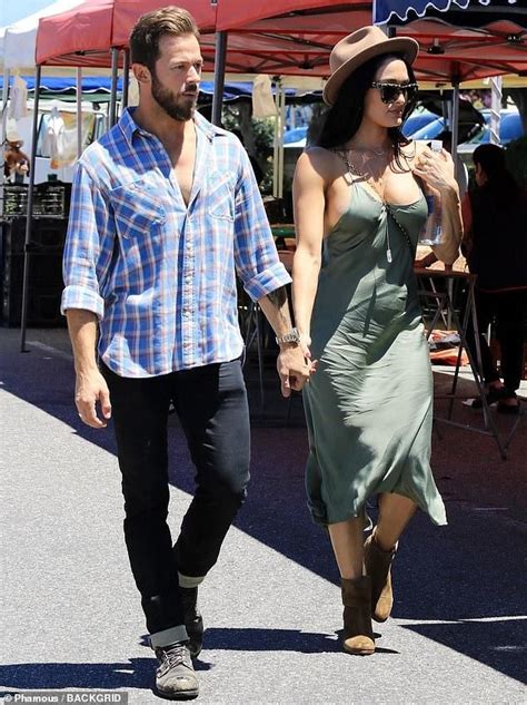 nikki bella styles up in a green dress as she and artem