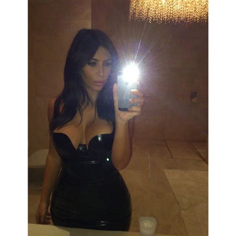 kim kardashian flaunts major cleavage in latest sexy selfie or célfie