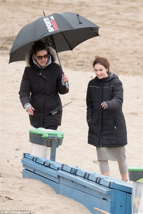 lily james covers up on location for new film in guernsey