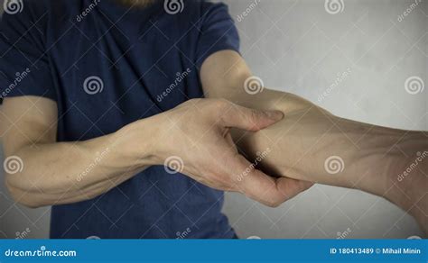 A Man Makes A Self Massage Of The Elbow Joint Stock Image Image Of
