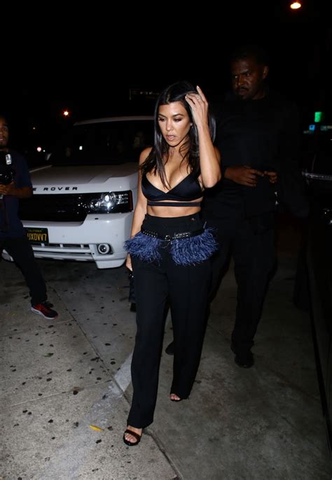 brunette kourtney kardashian stuns in a cleavage exposing outfit the