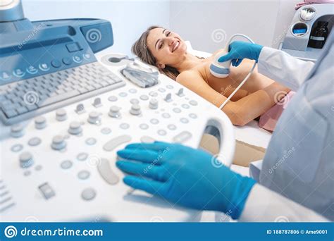 woman patient having ultrasound scan to prevent breast