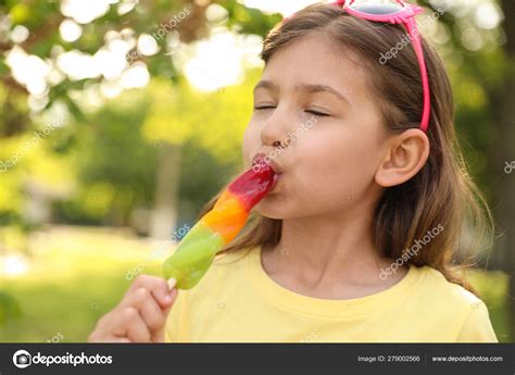 girl sucking popsicle