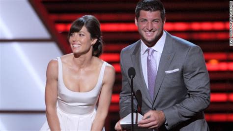 actress jessica biel and tebow present an award during the