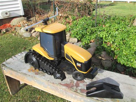 cat caterpillar challenger lawn tractor traveling sprinkler circa