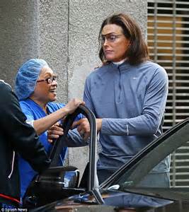 bruce jenner appears to be wearing spanx as he untucks his shirt after