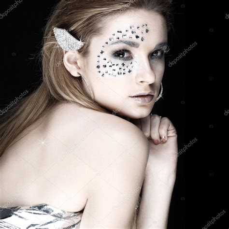 Portrait Of Sexual Beautiful Girl With Strasses On Face On A Black