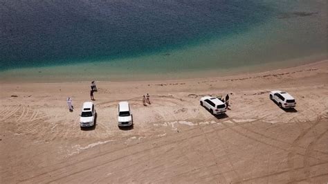 epic drone aerial shots  desert meets  sea khor al adaid qatar doha dune bashing