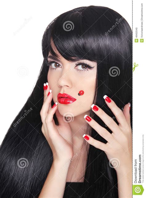 beautiful girl with long straight black hair red lips manicure stock