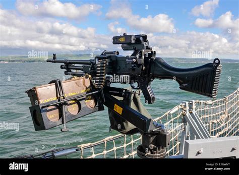 general purpose machine gun gpmg turrett mounted   royal navy ship stock photo alamy