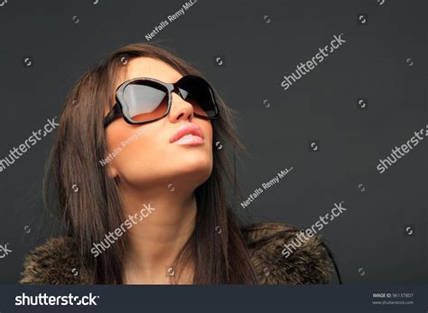 beautiful long hair brunette woman wearing sunglasses