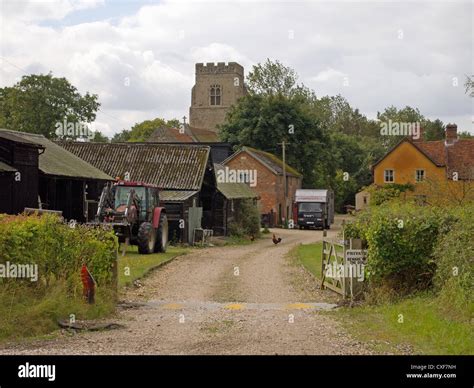 scene   english country farmyard  outbuildings tractor