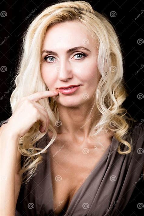 Close Up Of Red Lips Of Seductive Blonde Girl Raising Finger To Her