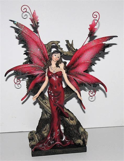 guardian  double tree trunk red fairy legends  avalon figurine metal wings enchanted