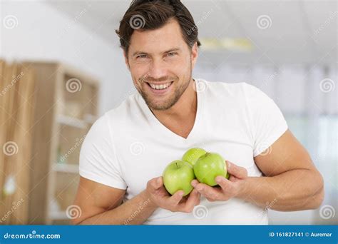 smiling man holding apples stock image image  holding