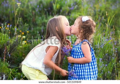two sisters kissing field foto de stock 501109849 shutterstock