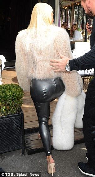 kim kardashian squeezes her curvy assets into pewter latex