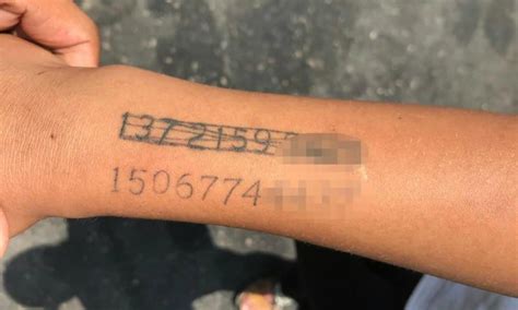 permanent number chinese mother tattoos phone number on son s arm strikes through old one