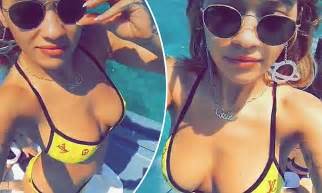 rita ora flaunts her ample assets in tiny yellow bikini daily mail online
