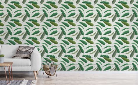 living room   white couch  green leaves wallpaper   wall