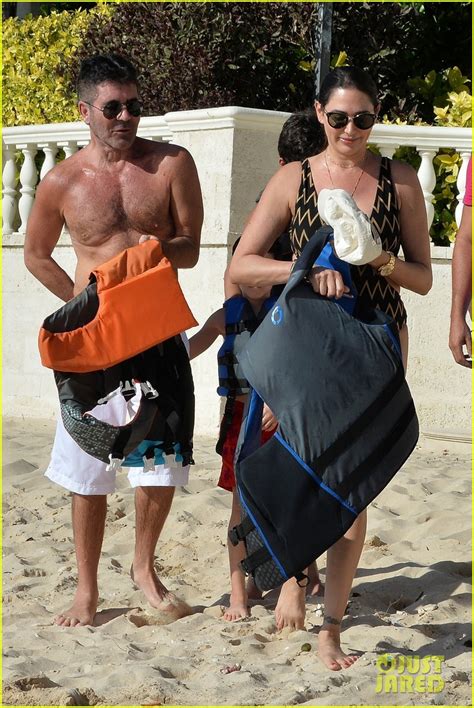 simon cowell bares fit physique on the beach with girlfriend lauren