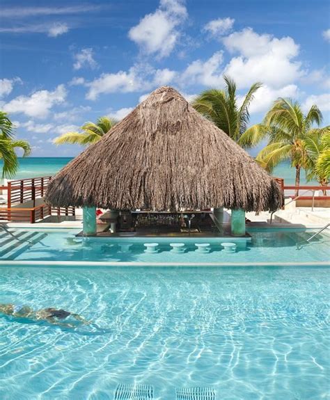 swim up pool bar couples swept away negril jamaica sunset