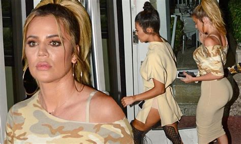 khloe kardashian puts on a booty ful display while kourtney flashes her
