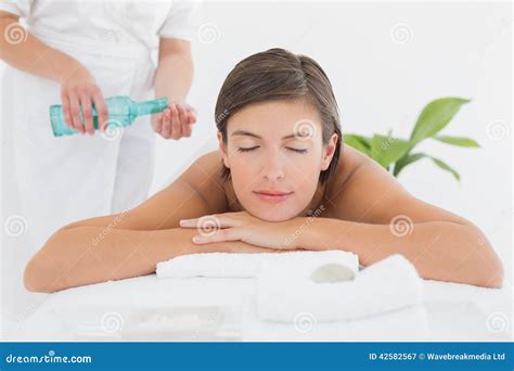 Attractive Woman Getting Massage Oil On Her Back Stock Image Image Of